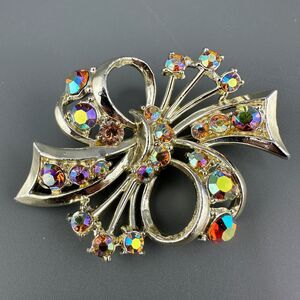 Vintage Rhinestone Brooch Ribbon Bow Gold Tone Orange Aurora Borealis Crystals